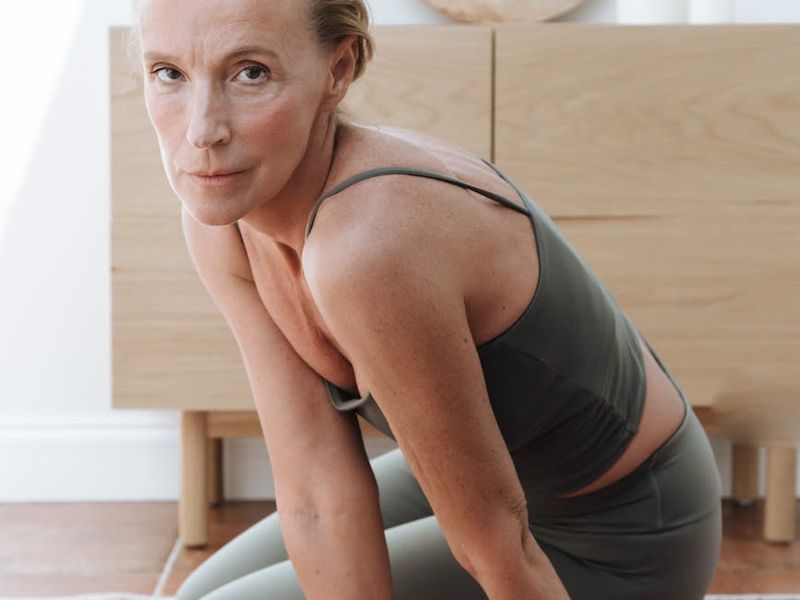 Person performing a series of flowing yoga movements gracefully