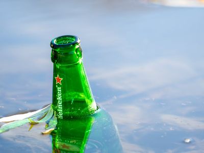 Sunlight reflecting off a glass water bottle during yoga