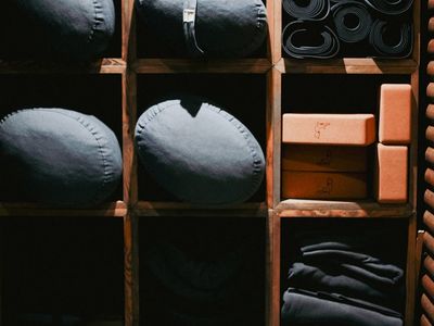 Yoga block and strap neatly placed on a mat